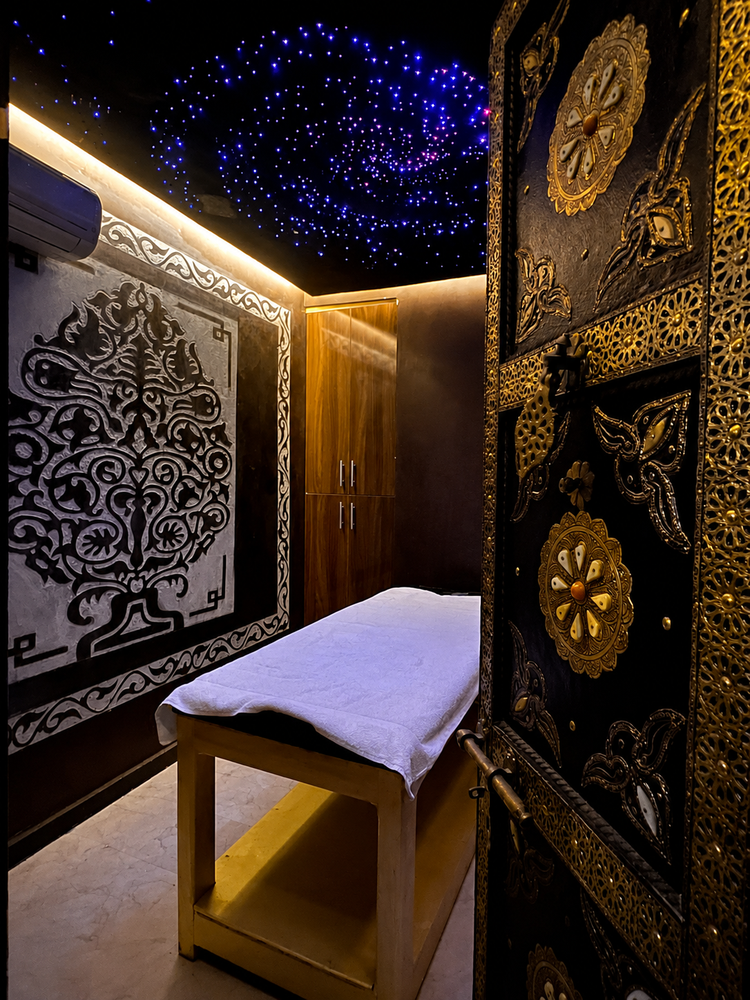 Women-only hammam ritual in Marrakech behind a private brass door — Mayzara Spa